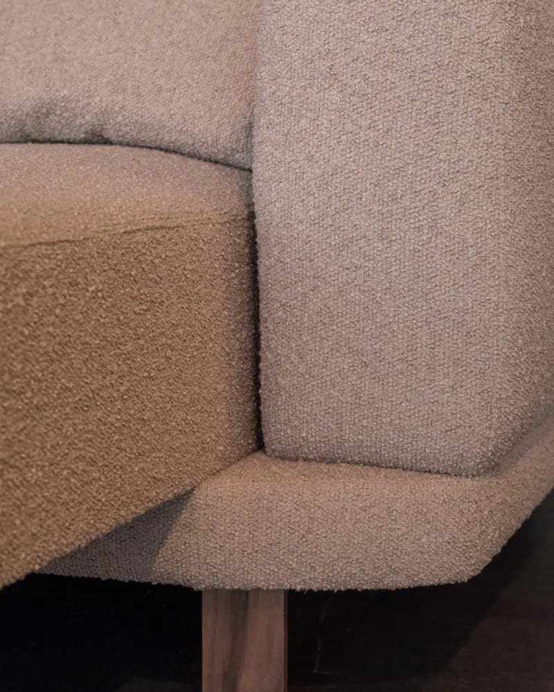Close-up of the Lund sofa: oatmeal bouclé on an oiled oak leg